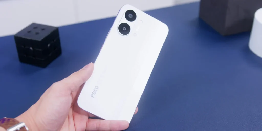 Close up of a person holding the Poco X8 Pro Max smartphone to show its real world size and ergonomics.