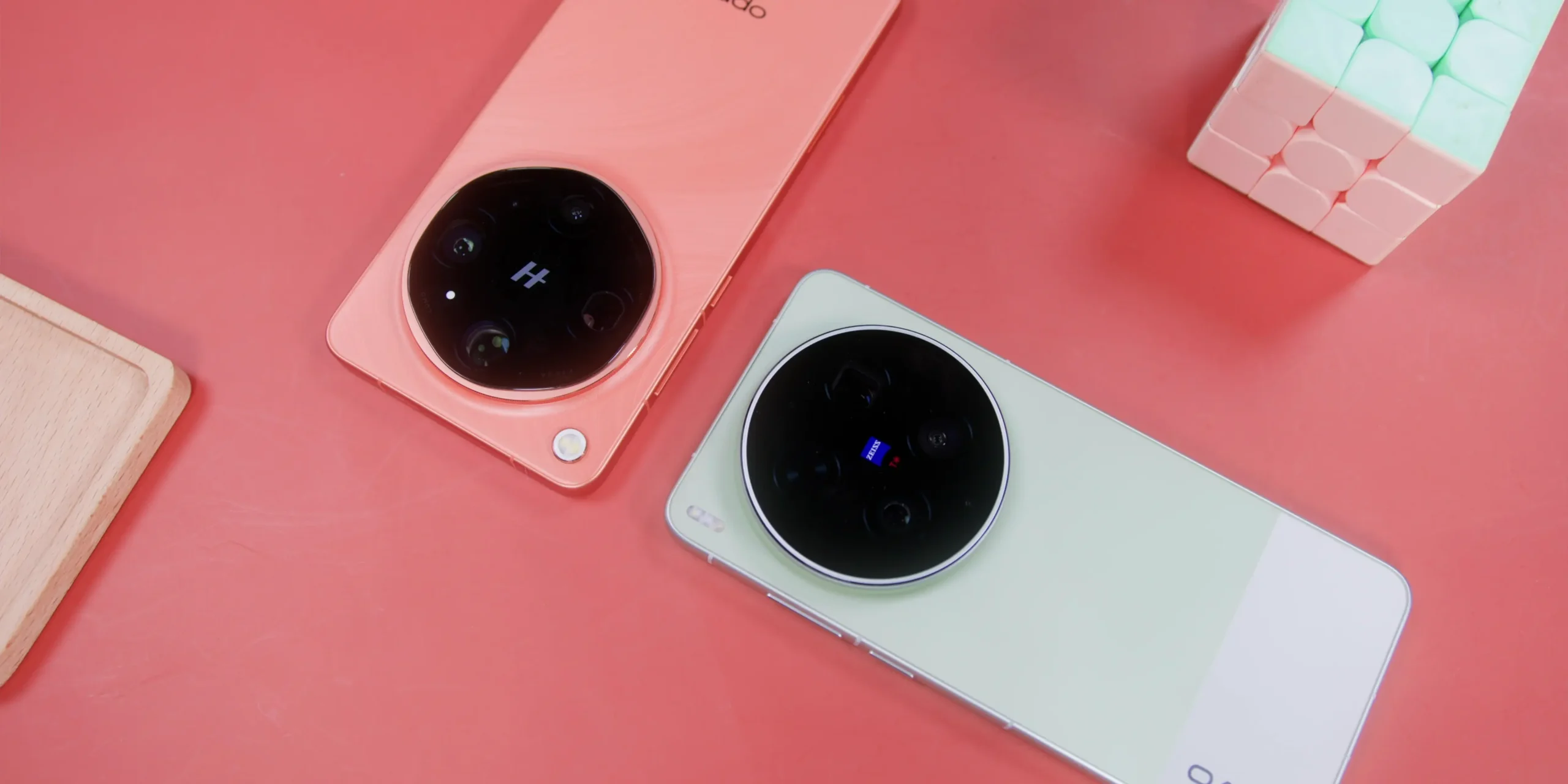 Hero shot comparing the Vivo X300 Ultra and Oppo Find X9 Ultra flagship smartphones side by side, highlighting their premium back panel designs and massive circular camera modules.